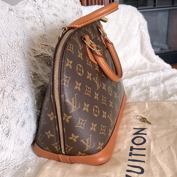 Louis Vuitton Handbags - Authentic LOUIS VUITTON Monogram Alma w/ lock and key